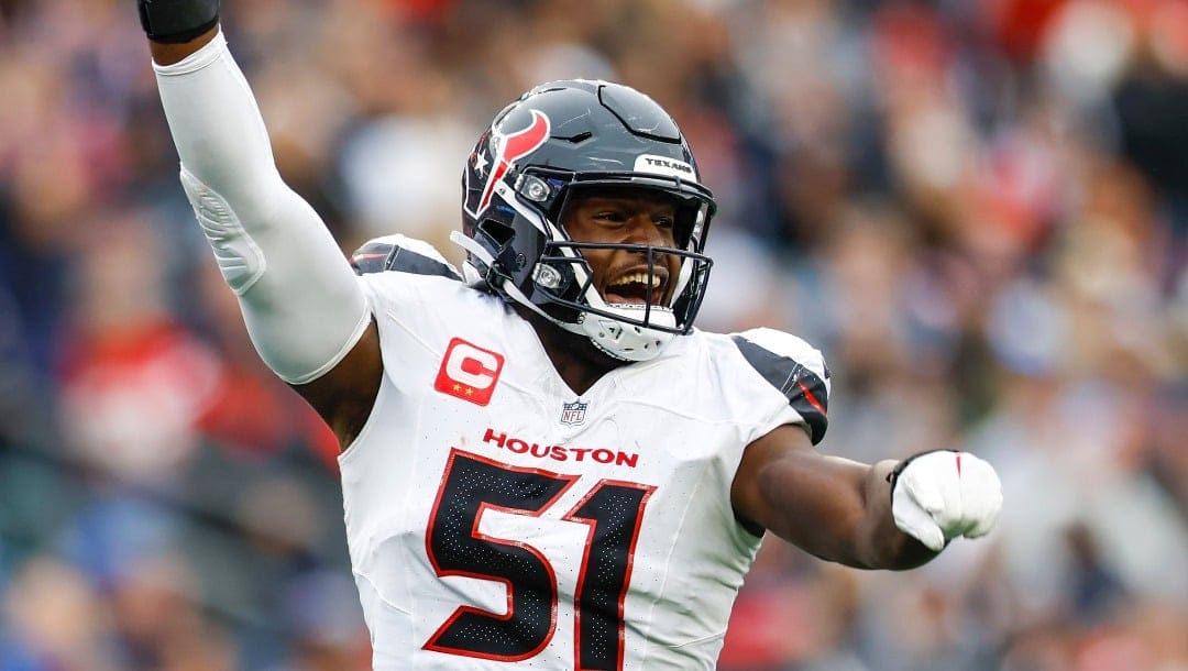 Houston Texans defensive end Will Anderson Jr. (51) reacts after a turnover during the second half of an NFL football game against the New England Patriots, Sunday, Oct. 13, 2024, in Foxborough, Mass. (AP Photo/Greg M. Cooper)