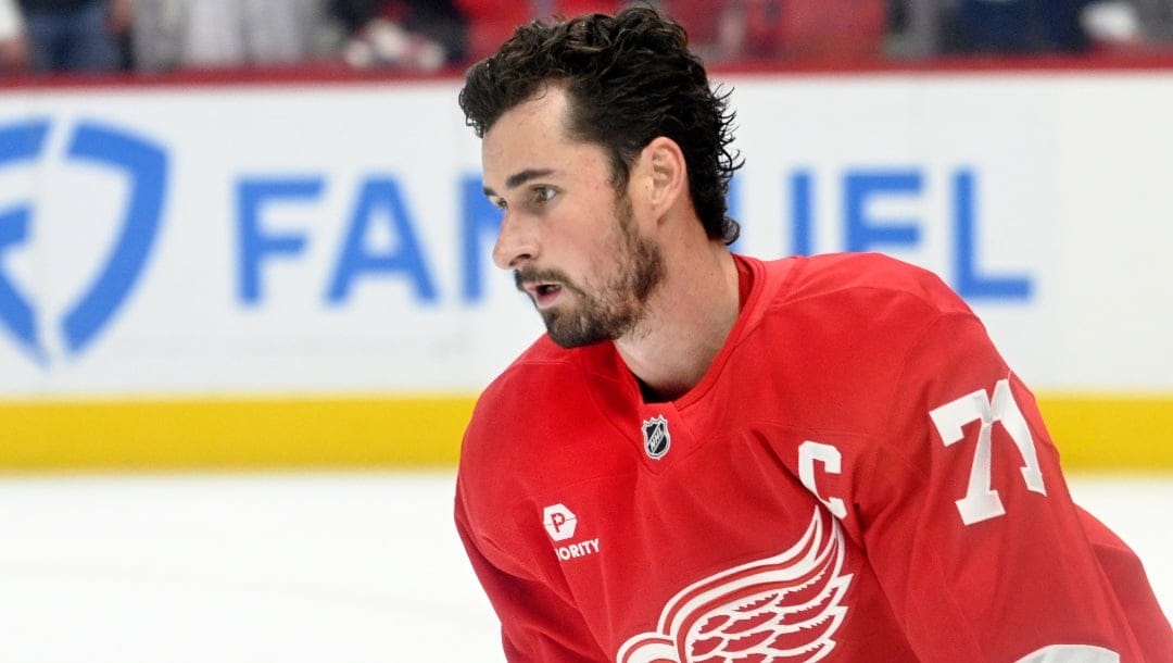 Detroit Red Wings' Dylan Larkin skates during pregame of an NHL hockey game against the New Jersey Devils, Thursday, Oct. 24, 2024, in Detroit. (AP Photo/Jose Juarez)