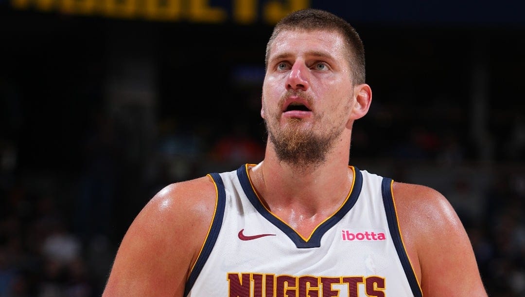 DENVER, CO - OCTOBER 13: Nikola Jokic #15 of the Denver Nuggets shoots a free throw during the game against the Phoenix Suns on October 13, 2024 at Ball Arena in Denver, Colorado. NOTE TO USER: User expressly acknowledges and agrees that, by downloading and/or using this Photograph, user is consenting to the terms and conditions of the Getty Images License Agreement. Mandatory Copyright Notice: Copyright 2024 NBAE