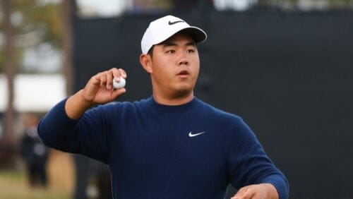 Tom Kim of Korea throws his ball into the stands after finishing his second round of the British Open Golf Championships at Royal Troon golf club in Troon, Scotland, Friday, July 19, 2024.