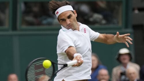 Switzerland's Roger Federer returns the ball to Italy's Lorenzo Sonego on day seven of the Wimbledon Tennis Championships in London, Monday, July 5, 2021. Roger Federer plans to play at his hometown tournament in October when the Swiss Indoors is staged for the first time since 2019, organizers in Basel said Tuesday, April 26, 2022. Federer has not played competitive tennis since undergoing another knee surgery after losing in the Wimbledon quarterfinals last July.