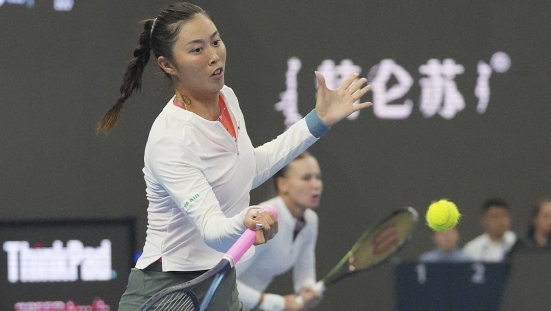 Chan Hao-Ching of Taiwan, left, and Veronika Kudermetova of Russia play against Jasmine Paolini and Sara Errani of Italy during the women's doubles final match at the China Open tennis tournament at the National Tennis Center in Beijing, Sunday, Oct. 6, 2024.