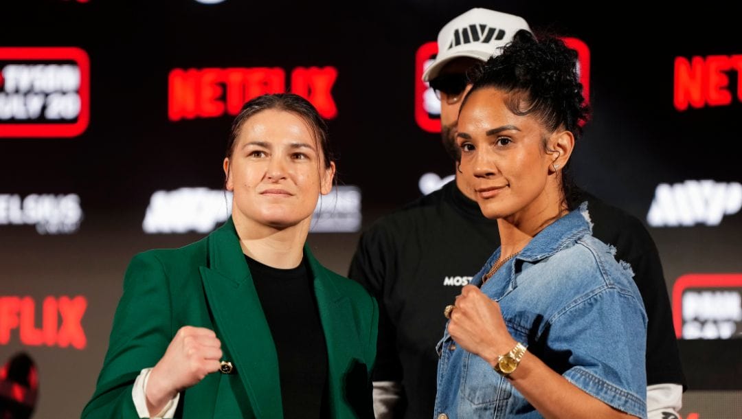 Katie Taylor, left, and Amanda Serrano pose for photos during a news conference promoting their upcoming boxing bout.