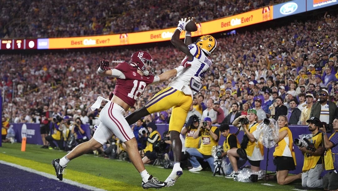 LSU tight end Trey'Dez Green (14) can't pull in a pass in the end zone as he is covered by Alabama defensive back Bray Hubbard (18) in the first half an NCAA college football game in Baton Rouge, La., Saturday, Nov. 9, 2024.