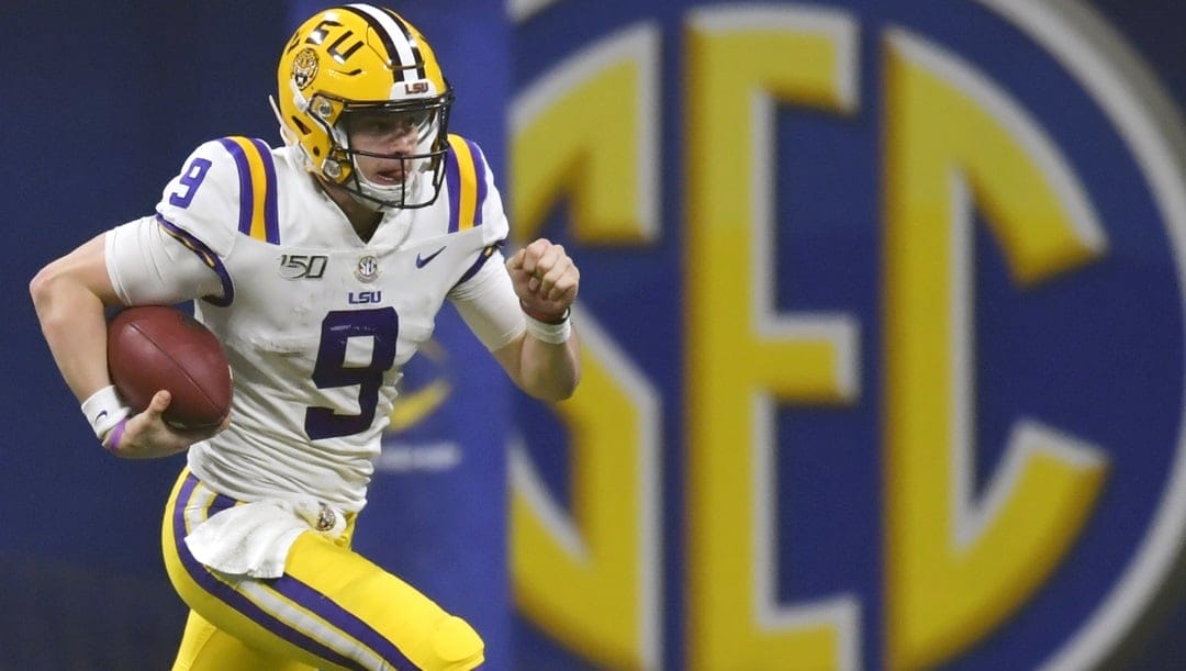 In this Dec. 7, 2019, file photo, LSU quarterback Joe Burrow (9) runs against Georgia during the second half of the Southeastern Conference championship NCAA college football game, in Atlanta. The Southeastern Conference broke the NFL record for first-round draft picks by a conference. Fifteen players from the powerhouse league were selected in the opening round Thursday night, April 23, 2020.