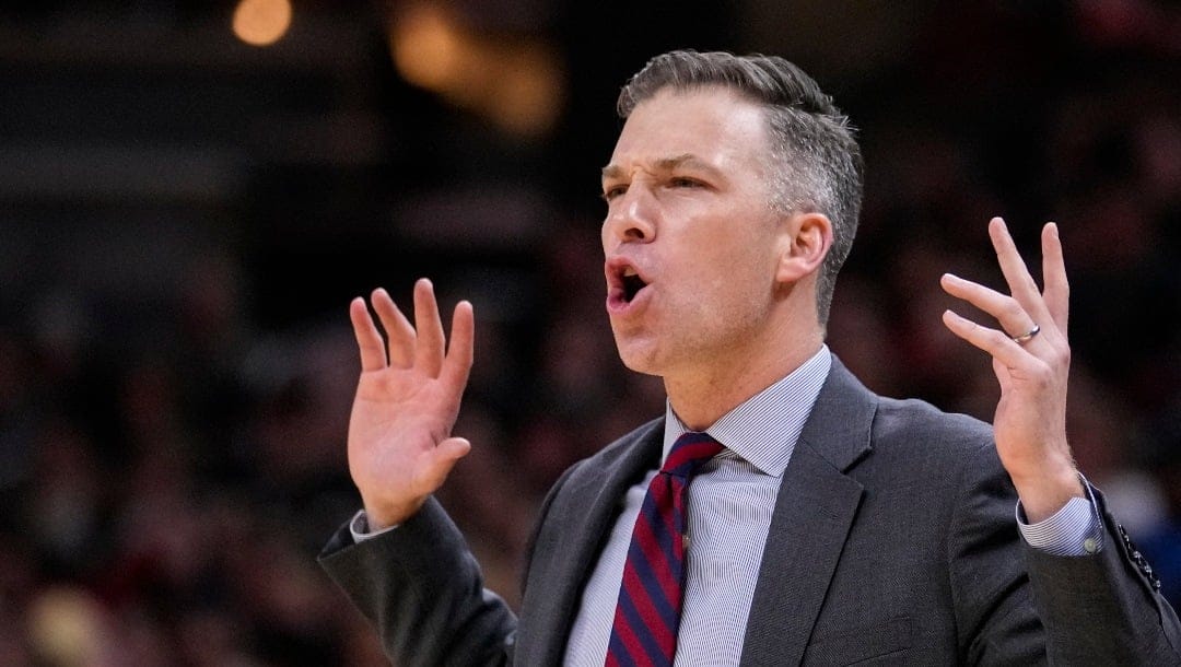 Davidson head coach Matt McKillop questions a call as his team played against Purdue in the second half of an NCAA college basketball game in Indianapolis, Saturday, Dec. 17, 2022. (AP Photo/Michael Conroy)