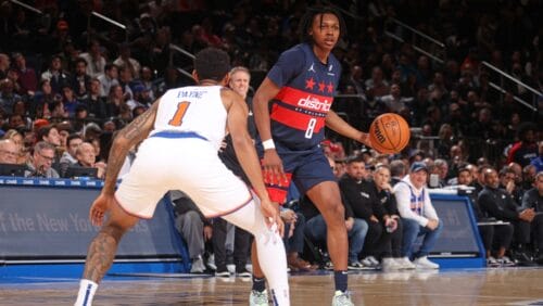 Bub Carrington #8 of the Washington Wizards looks to pass the ball during the game against the New York Knicks on November 18, 2024 at Madison Square Garden in New York City, New York.