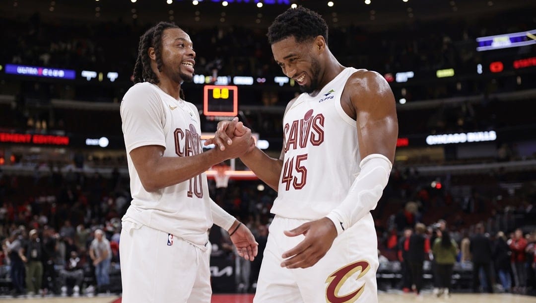 CHICAGO, ILLINOIS - NOVEMBER 11: Darius Garland (L) #10 of the Cleveland Cavaliers and Donovan Mitchell #45 of the Cleveland Cavaliers celebrate their win over the Chicago Bulls at the United Center on November 11, 2024 in Chicago, Illinois.