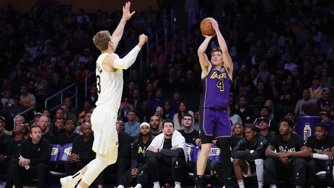 Dalton Knecht #4 of the Los Angeles Lakers shoots a 3-point basket against Lauri Markkanen #23 of the Utah Jazz during the first quarter of the Emirates NBA Cup at Crypto.com Arena on November 19, 2024 in Los Angeles, California.