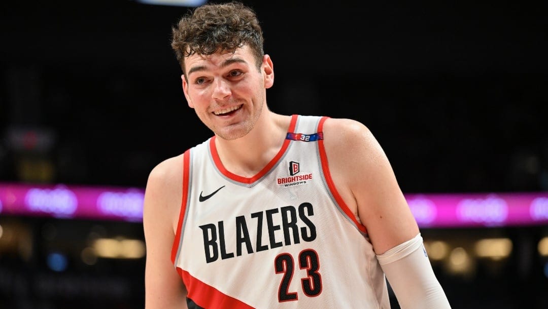 Donovan Clingan #23 of the Portland Trail Blazers smiles during the game against the Minnesota Timberwolves at Moda Center on November 13, 2024 in Portland, Oregon.