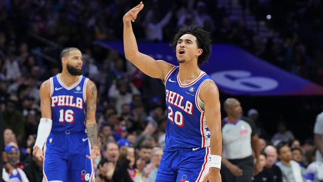 Jared McCain #20 of the Philadelphia 76ers reacts against the Charlotte Hornets in the second half at the Wells Fargo Center on November 10, 2024 in Philadelphia, Pennsylvania. The 76ers defeated the Hornets 107-105 in overtime.