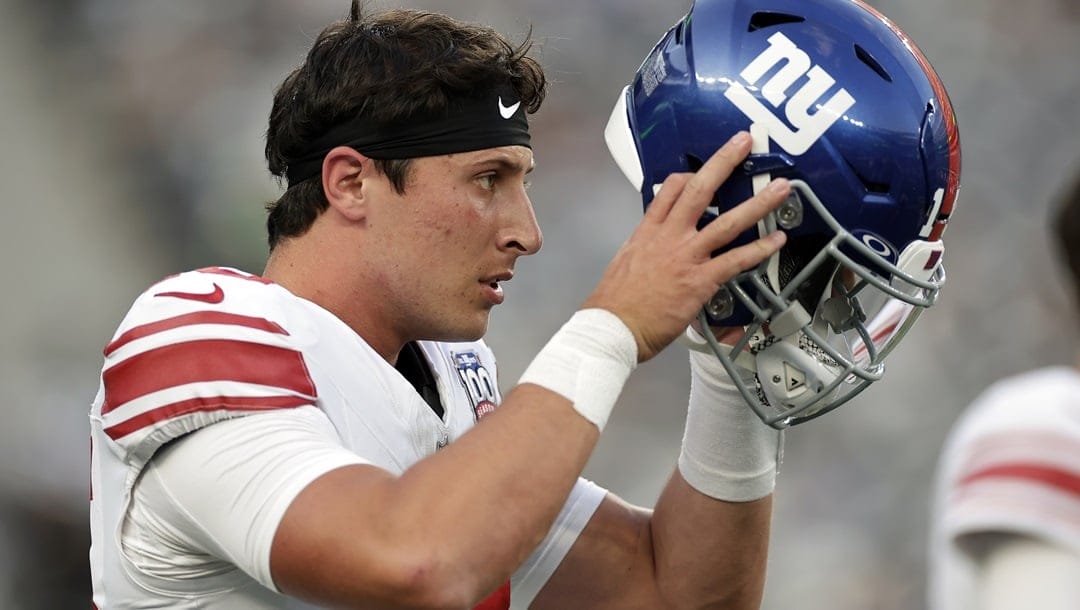 New York Giants quarterback Tommy DeVito (15) warms up before a preseason NFL football game against the New York Jets Saturday, Aug. 24, 2024, in East Rutherford, N.J.