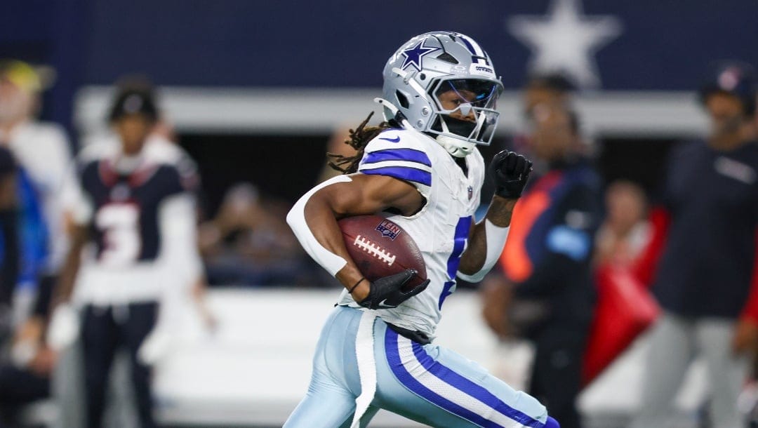 Dallas Cowboys wide receiver KaVontae Turpin runs for a long touchdown after making a catch against the Houston Texans during the first half of an NFL football game, Monday, Nov. 18, 2024, in Arlington, Texas. (AP Photo/Gareth Patterson)