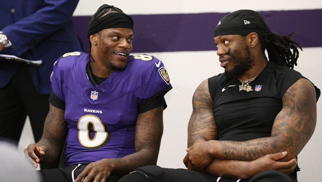 Baltimore Ravens quarterback Lamar Jackson, left, jokes with running back Derrick Henry, right, as they wait to talk at a news conference after defeating the Denver Broncos in an NFL football game Sunday, Nov. 3, 20204, in Baltimore.