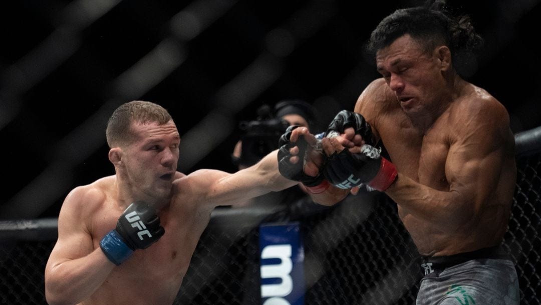 Petr Yan, left, fights Douglas Silva de Andrade during the second round of a bantamweight mixed martial arts bout at UFC 232.