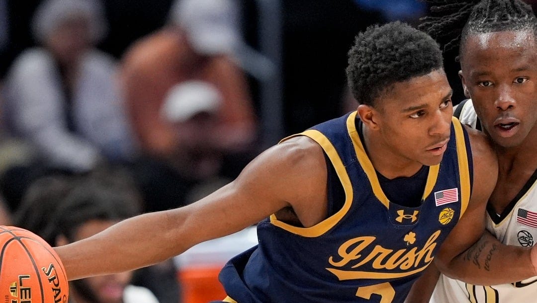 FILE - Notre Dame guard Markus Burton (3) drives against Wake Forest guard Kevin Miller (0) during the first half of the Atlantic Coast Conference second round NCAA college basketball tournament game, March 13, 2024, in Washington. (AP Photo/Susan Walsh, File)