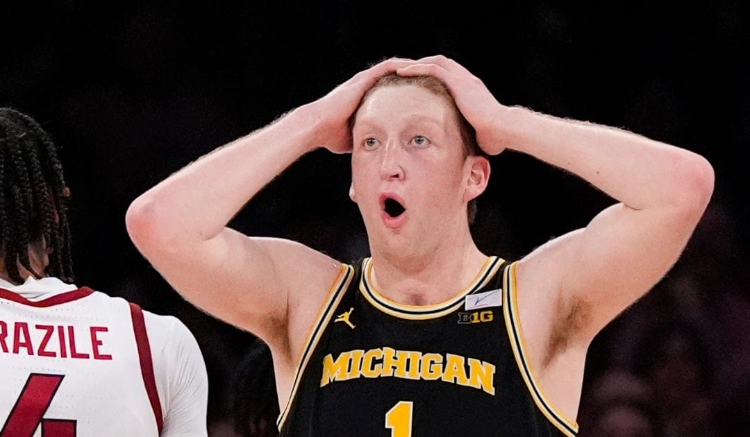 Michigan center Danny Wolf (1) reacts during the second half of an NCAA college basketball game against Arkansas, Tuesday, Dec. 10, 2024, in New York. Arkansas won 89-87. (AP Photo/Julia Demaree Nikhinson)