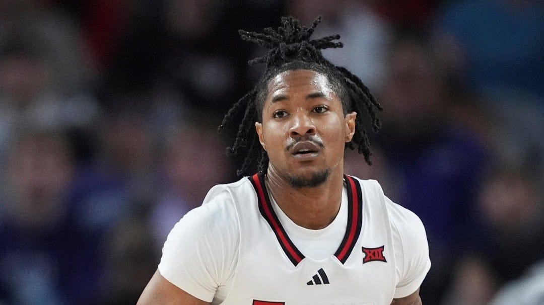 Texas Tech guard Elijah Hawkins advances the ball against Texas A&M during an NCAA college basketball game in Fort Worth, Texas, Sunday, Dec. 8, 2024. (AP Photo/Tony Gutierrez)