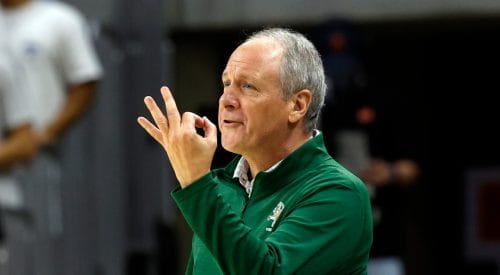 Vermont head coach John Becker signals to players during the first half of an NCAA college basketball game against Auburn, Wednesday, Nov. 6, 2024, in Auburn, Ala. (AP Photo/ Butch Dill)