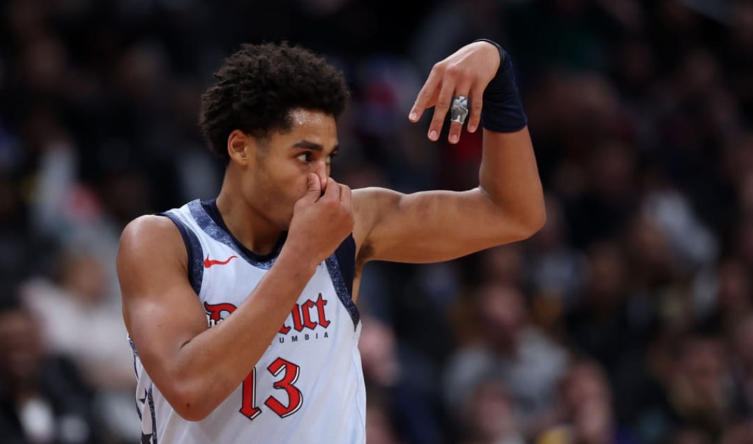 WASHINGTON, DC - DECEMBER 07: Jordan Poole #13 of the Washington Wizards holds his nose as he celebrates after scoring against the Denver Nuggets during the second half at Capital One Arena on December 7, 2024 in Washington, DC. NOTE TO USER: User expressly acknowledges and agrees that, by downloading and or using this photograph, User is consenting to the terms and conditions of the Getty Images License Agreement.