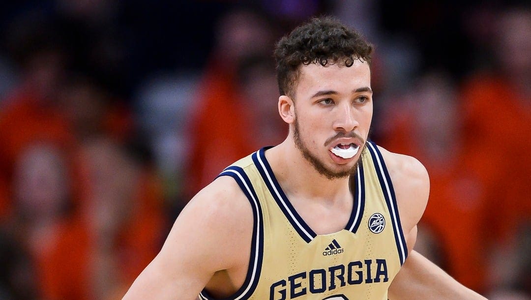 Georgia Tech guard Lance Terry (0) handles the ball during the second half of an NCAA college basketball game against Syracuse in Syracuse, N.Y., Tuesday, Feb. 28, 2023. (AP Photo/Adrian Kraus)