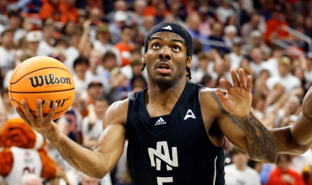 North Alabama guard Jacari Lane (5) looks to go up for a basket as Auburn guard JP Pegues (1) defends during the first half of an NCAA college basketball game, Monday, Nov. 18, 2024, in Auburn, Ala. (AP Photo/Butch Dill)