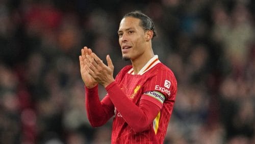 Liverpool's Virgil van Dijk applauds the crowd after the English Premier League soccer match between Liverpool and Newcastle United at Anfield in Liverpool, Wednesday, Feb. 26, 2025. (AP Photo/Jon Super)