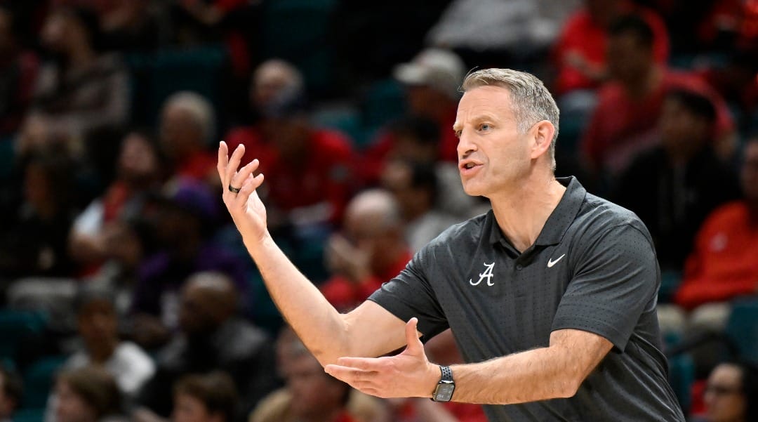 Alabama head coach Nate Oats calls to his team during the first half of an NCAA college basketball game against Rutgers Wednesday, Nov. 27, 2024, in Las Vegas. (AP Photo/David Becker)