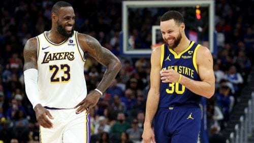 LeBron James #23 of the Los Angeles Lakers and Stephen Curry #30 of the Golden State Warriors make each other laugh during a stop in play in the first half at Chase Center on January 27, 2024 in San Francisco, California.