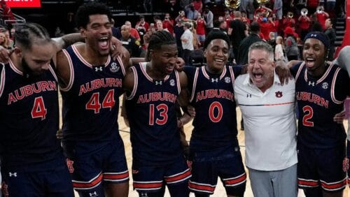 Auburn forward Johni Broome (4), center Dylan Cardwell (44), guard Miles Kelly (13), guard Tahaad Pettiford (0), head coach Bruce Pearl and guard Denver Jones (2) celebrate after an NCAA college basketball game against Houston Saturday, Nov. 9, 2024, in Houston.