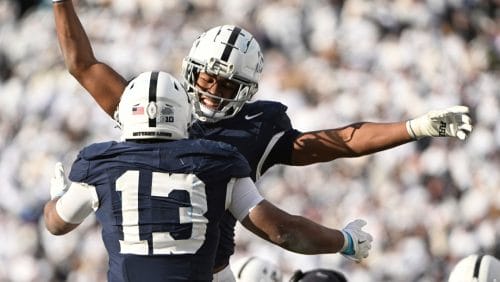 Penn State running back Kaytron Allen (13) celebrates after a touchdown with Nicholas Singleton, second from left, during the second half against SMU in the first round of the College Football Playoff, Saturday, Dec. 21, 2024, in State College, Pa.