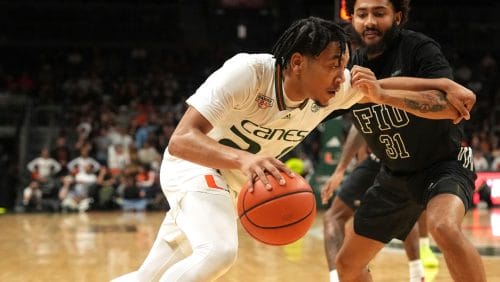 FILE - Miami guard Nijel Pack drives past Florida International guard George Pridgett Jr. (31) during the first half of an NCAA college basketball game, Nov. 13, 2023, in Coral Gables, Fla. (AP Photo/Jim Rassol, File)