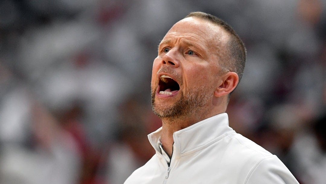 Louisville head coach Pat Kelsey shouts instructions to his team during the second half of an NCAA college basketball game against Tennessee in Louisville, Ky., Saturday, Nov. 9, 2024. Tennessee won 77-55. (AP Photo/Timothy D. Easley)