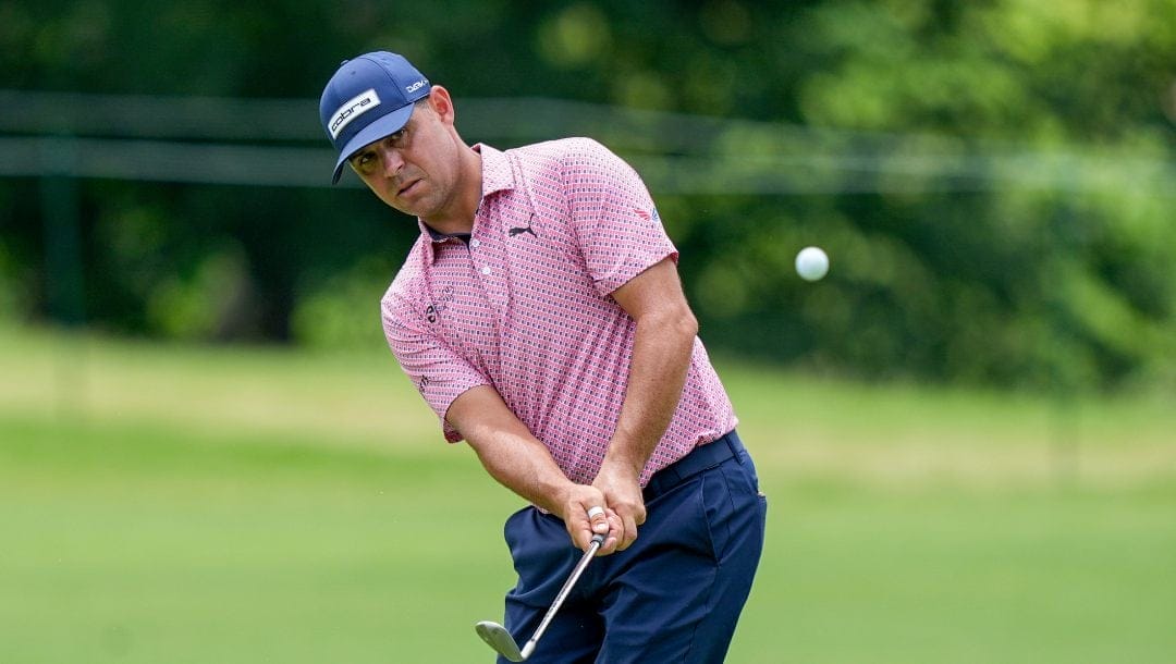 Gary Woodland chips onto the seventh green during the first round of the Charles Schwab Challenge golf tournament at Colonial Country Club, Thursday, May 23, 2024, in Fort Worth, Texas.