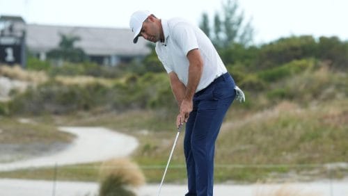 Scottie Scheffler, of the United States, watches his putt on the third green during the first round of the Hero World Challenge PGA Tour at the Albany Golf Club, in New Providence, Bahamas, Thursday, Dec. 5, 2024.