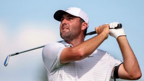 Scottie Scheffler hits his tee shot on the ninth hole during the third round of the Tour Championship golf tournament, Saturday, Aug. 31, 2024, in Atlanta.