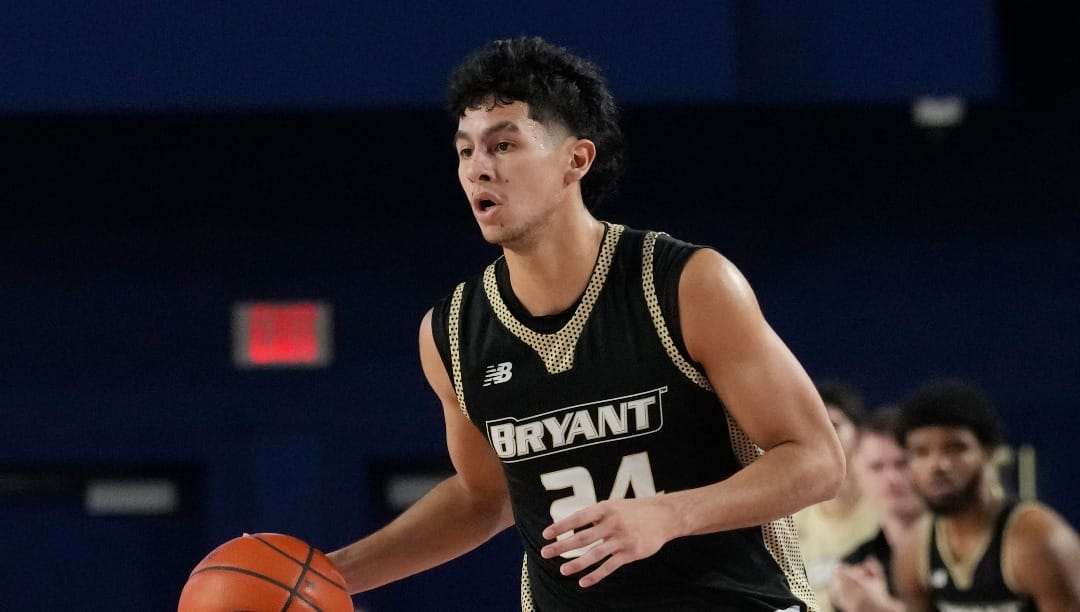 Bryant University guard Rafael Pinzon (24) dribbles the ball during the first half of an NCAA college basketball game against Florida Atlantic, Saturday, Nov. 18, 2023, in Boca Raton, Fla. (AP Photo/Marta Lavandier)