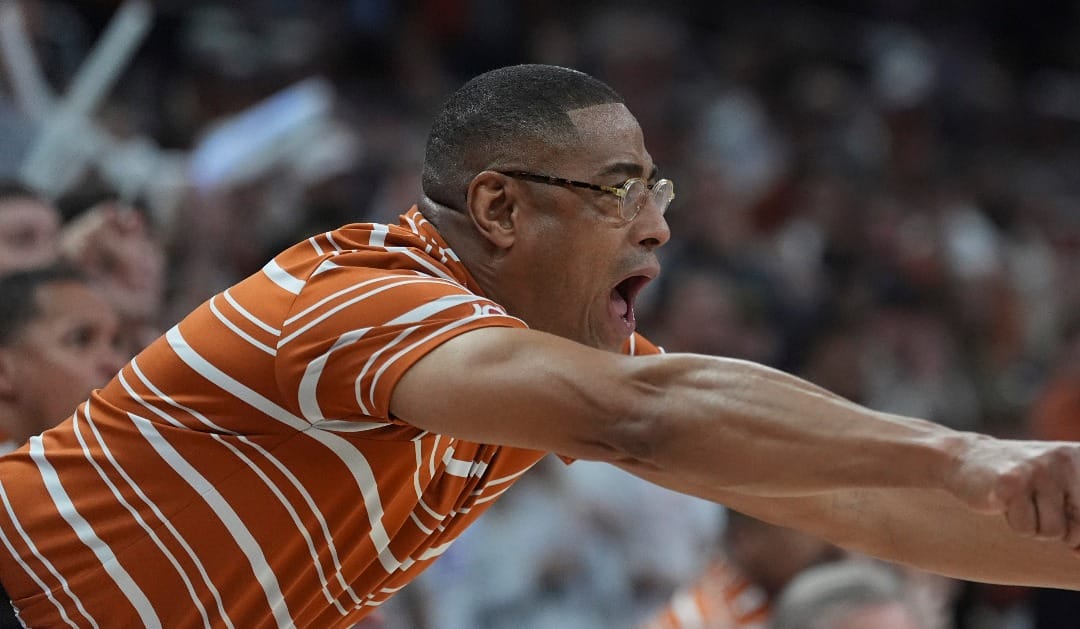 Texas head coach Rodney Terry calls to his players during the second half of an NCAA college basketball game against UConn in Austin, Texas, Sunday, Dec. 8, 2024. (AP Photo/Eric Gay)