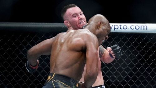 Colby Covington, left, exchanges punches with Kamaru Usman during a welterweight mixed martial arts championship bout.