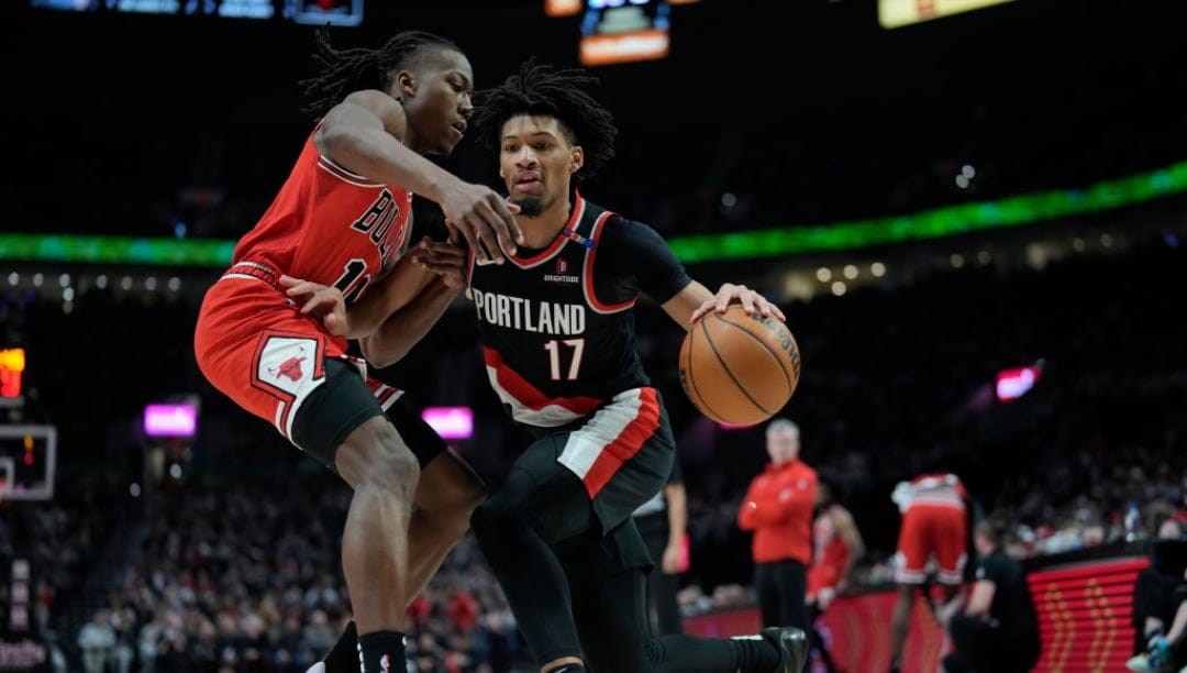 PORTLAND, OREGON - JANUARY 19: Shaedon Sharpe #17 of the Portland Trail Blazers dribbles the ball against Ayo Dosunmu #11 of the Chicago Bulls during the first half at Moda Center on January 19, 2025 in Portland, Oregon. NOTE TO USER: User expressly acknowledges and agrees that, by downloading and or using this photograph, User is consenting to the terms and conditions of the Getty Images License Agreement.