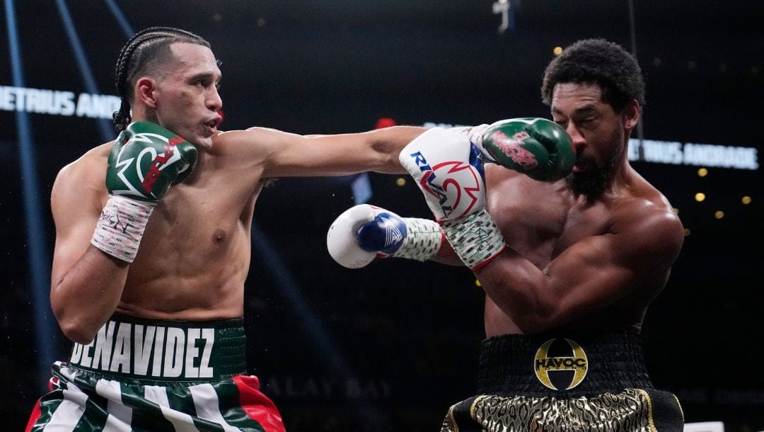 David Benavidez hits Demetrius Andrade in a super middleweight boxing bou Saturday, Nov. 25, 2023, in Las Vegas.