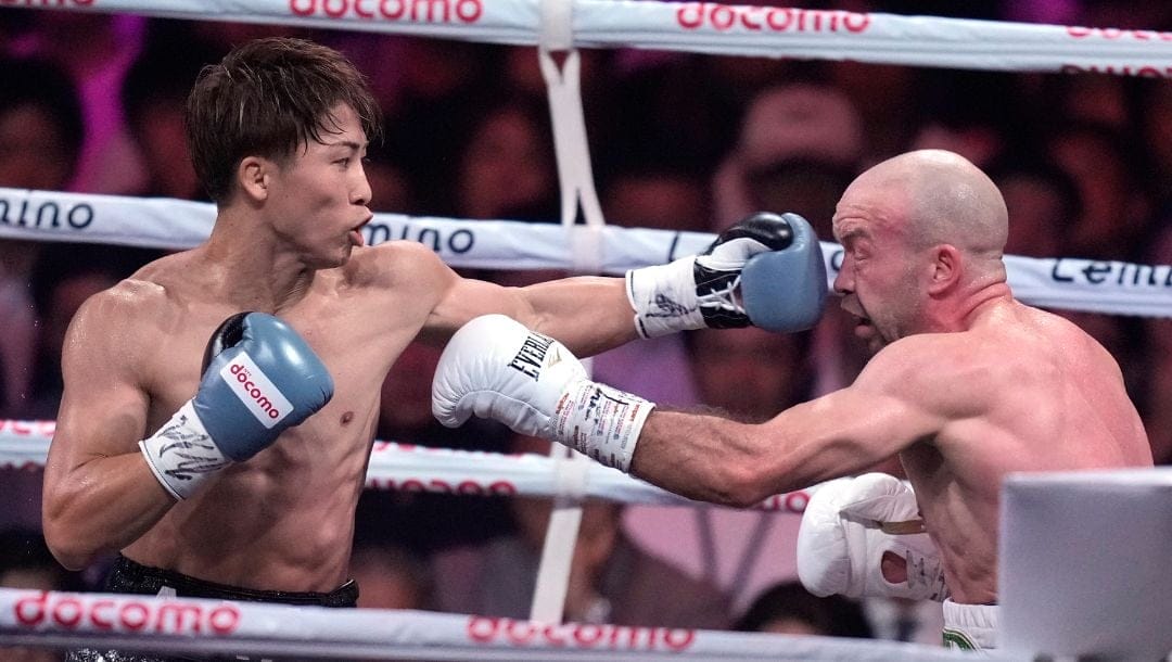 Japanese champion Naoya Inoue, left, and Irish challenger TJ Doheny, right, during the first round of a boxing match.