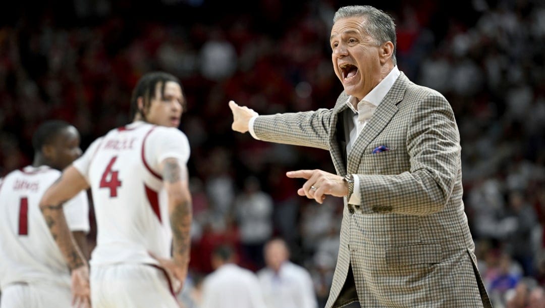 Arkansas coach John Calipari talks to his team during a timeout against Florida during an NCAA college basketball game Saturday, Jan. 11, 2025, in Fayetteville, Ark.