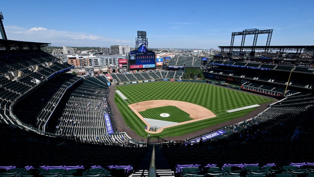 A purple row of seats delineates 5,280 feet of elevation at Coors Field before a baseball game between the Colorado Rockies and the Chicago Cubs, Sunday, Sept. 15, 2024, in Denver.