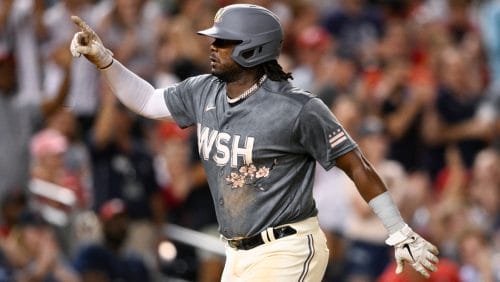 Washington Nationals' Josh Bell celebrates his three-run home run during the seventh inning of the team's baseball game against the St. Louis Cardinals, July 30, 2022, in Washington.