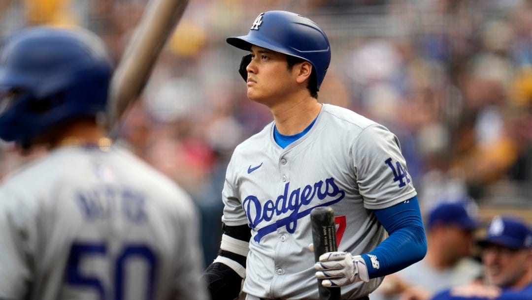 Los Angeles Dodgers' Shohei Ohtani (17) and Mookie Betts (50) wait on deck during the first inning of a baseball game against the Pittsburgh Pirates in Pittsburgh, Wednesday, June 5, 2024.