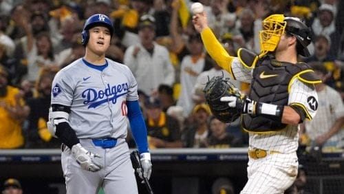 Los Angeles Dodgers' Shohei Ohtani strikes out as San Diego Padres catcher Kyle Higashioka throws the ball back during the eighth inning in Game 3 of a baseball NL Division Series, Tuesday, Oct. 8, 2024, in San Diego.