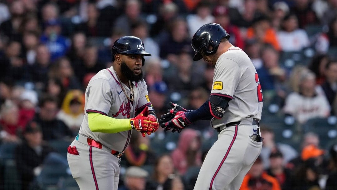 Atlanta Braves' Austin Riley, right, celebrates with Marcell Ozuna after hitting a solo home run against the San Francisco Giants during the fifth inning of a baseball game Wednesday, Aug. 14, 2024, in San Francisco.