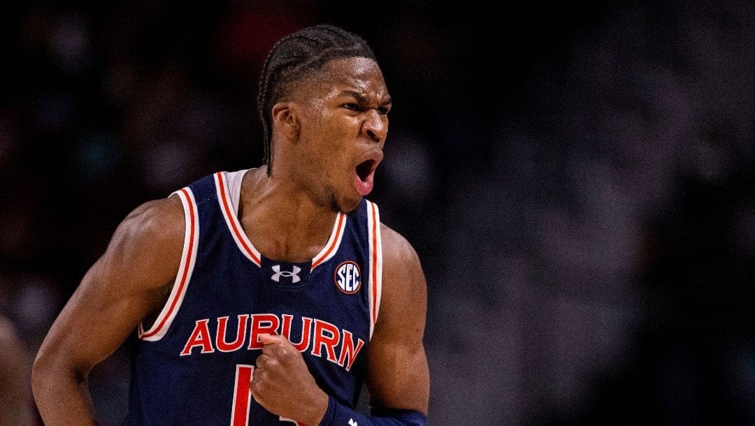 Auburn guard Miles Kelly (13) celebrates during the second half of an NCAA college basketball game against the South Carolina, Saturday, Jan. 11, 2025, in Columbia, S.C.