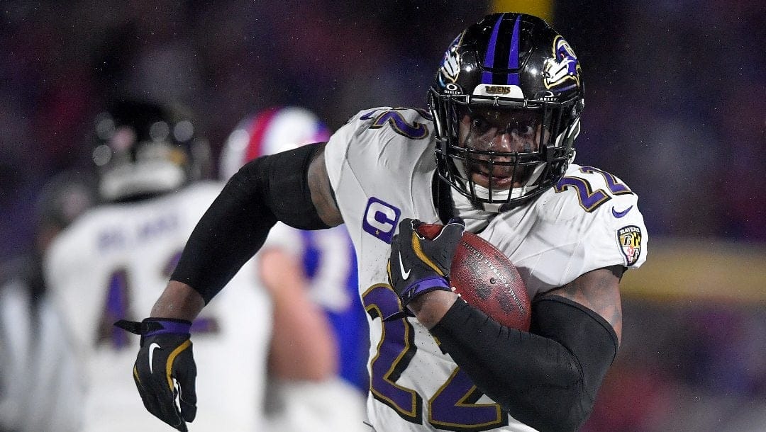 Baltimore Ravens running back Derrick Henry (22) carries the ball against the Buffalo Bills during the third quarter of an NFL divisional playoff football game, Sunday, Jan. 19, 2025, in Orchard Park, N.Y.